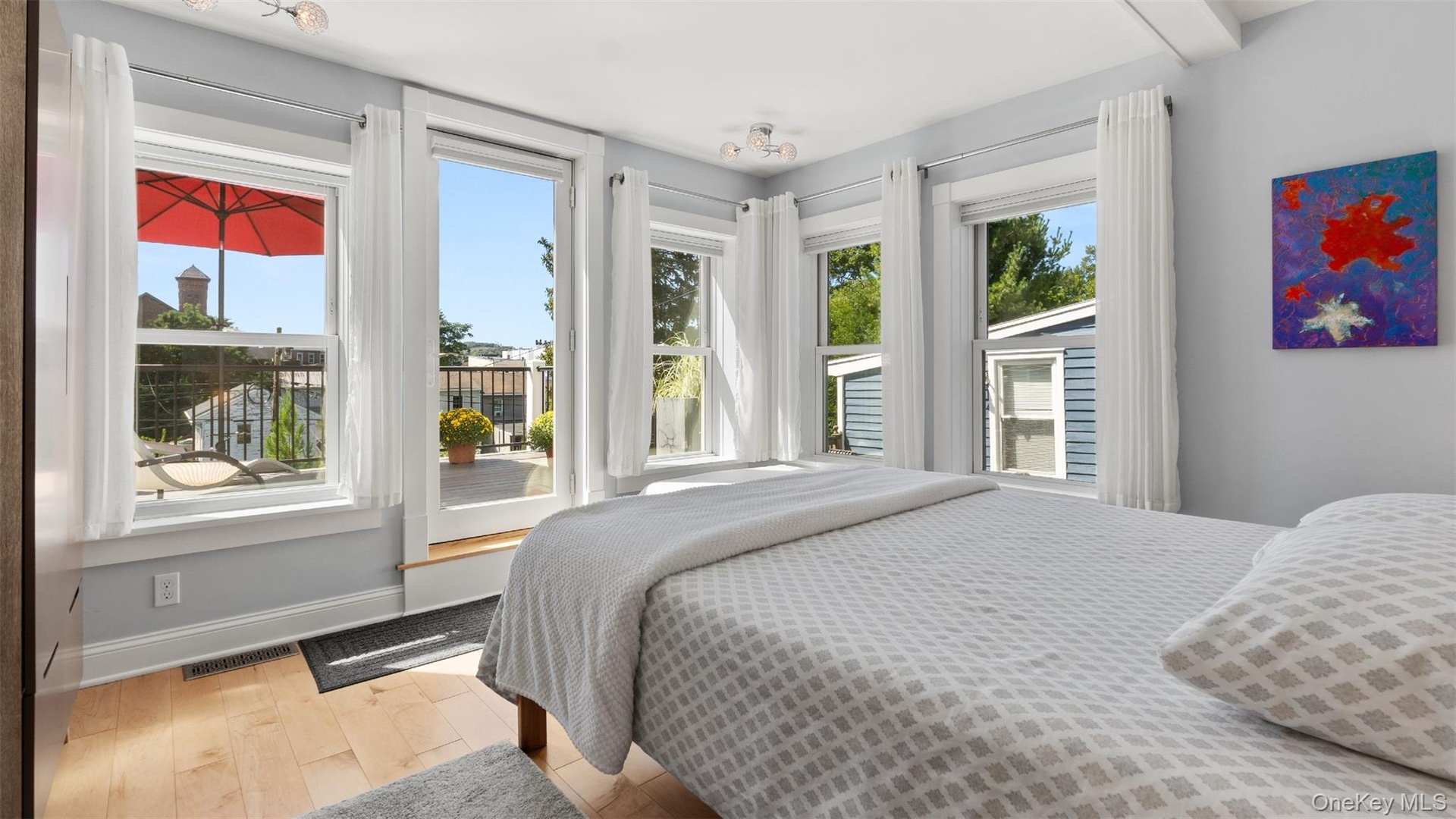 Second floor primary with private balcony and en suite bathroom.