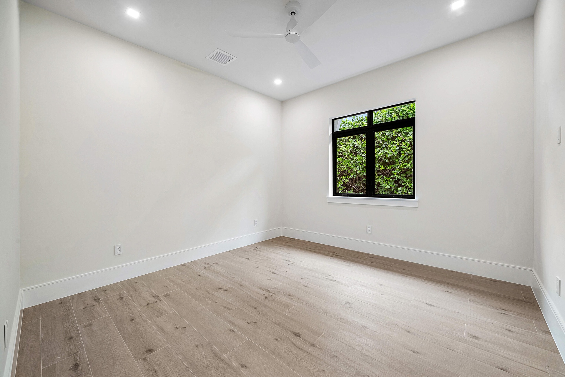 Bedroom #3 with a full bathroom and custom closets.
