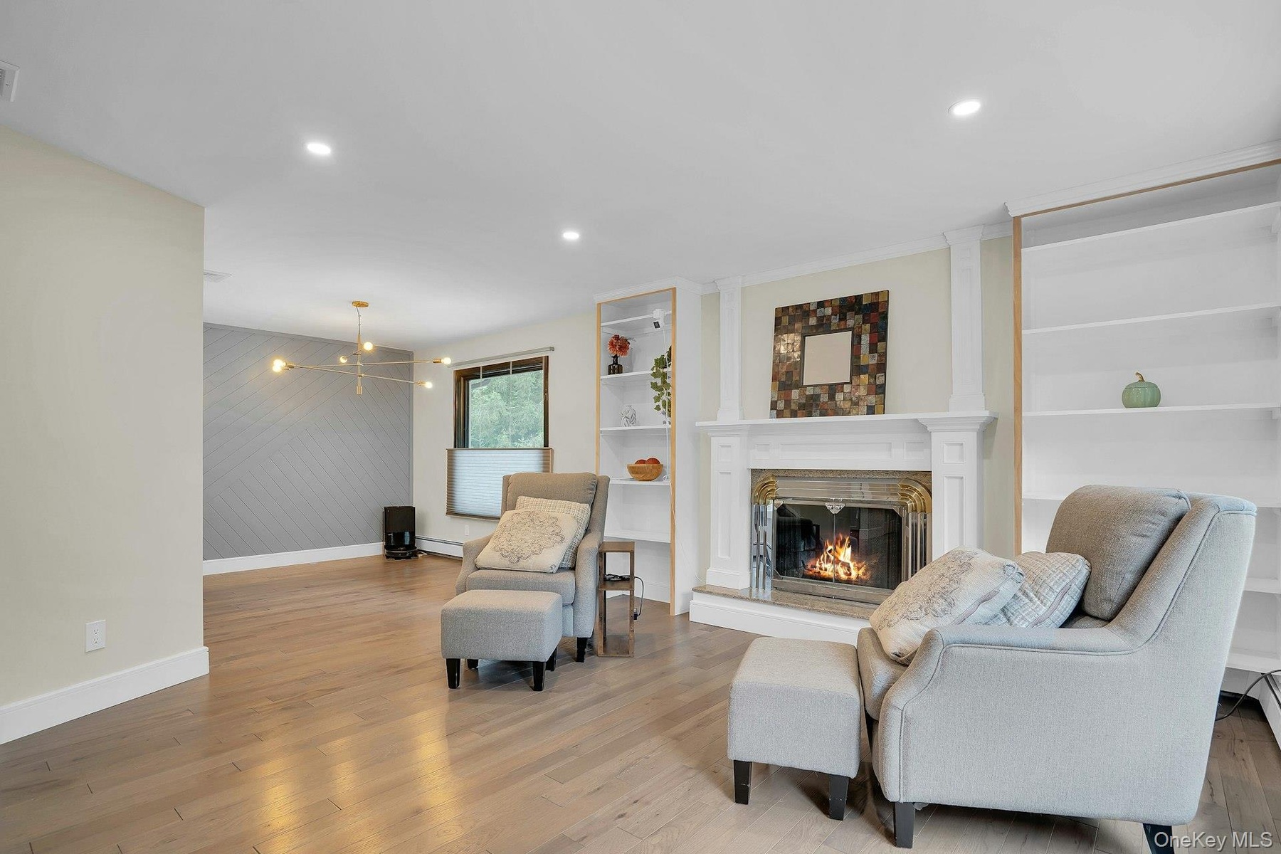 Beautiful fireplace with built-in shelving.