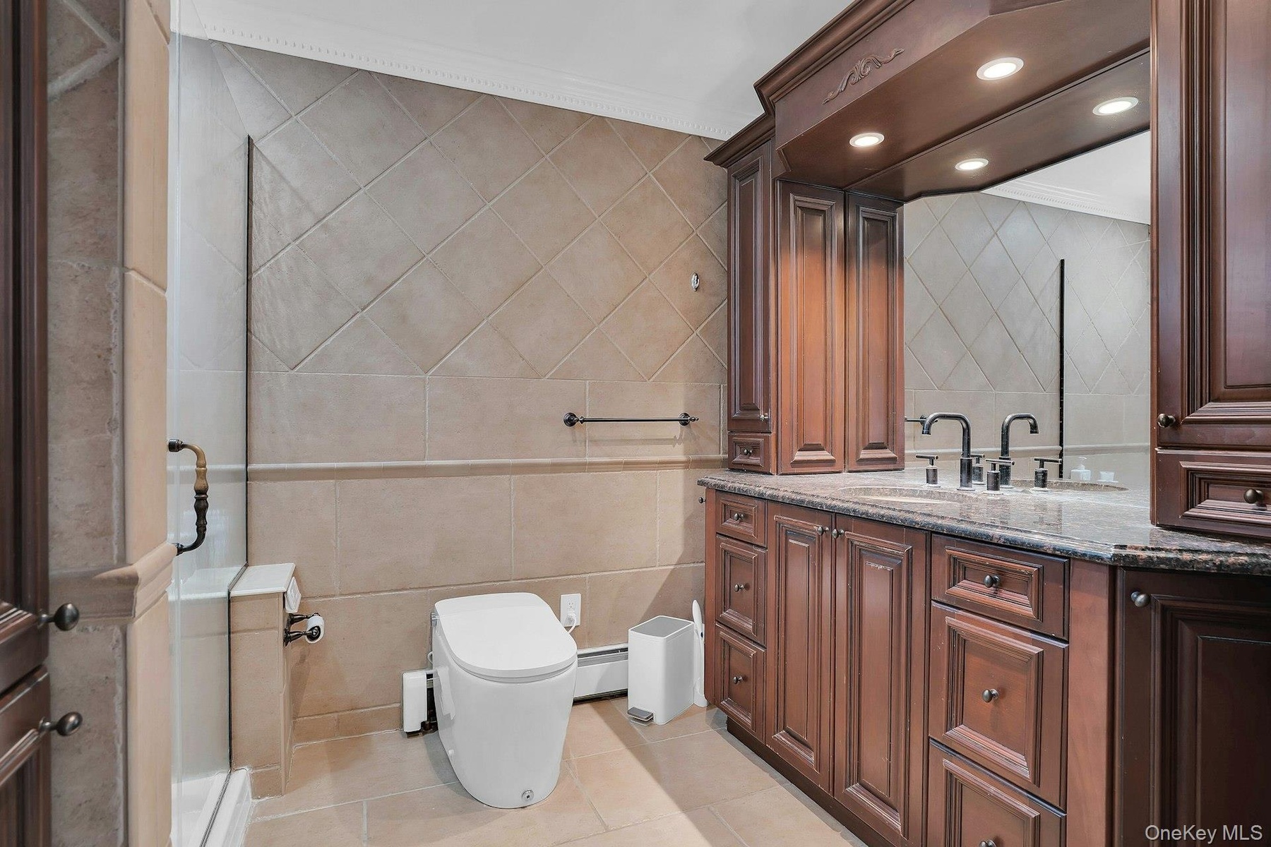 Custom cabinets, granite counters and big shower.