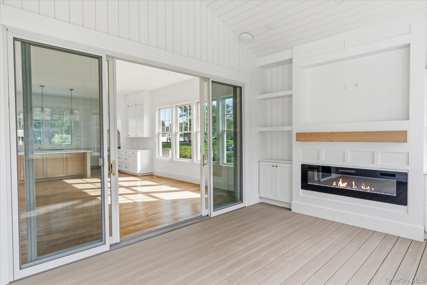 Three Season room with fireplace and TV hook ups with built in cabinets