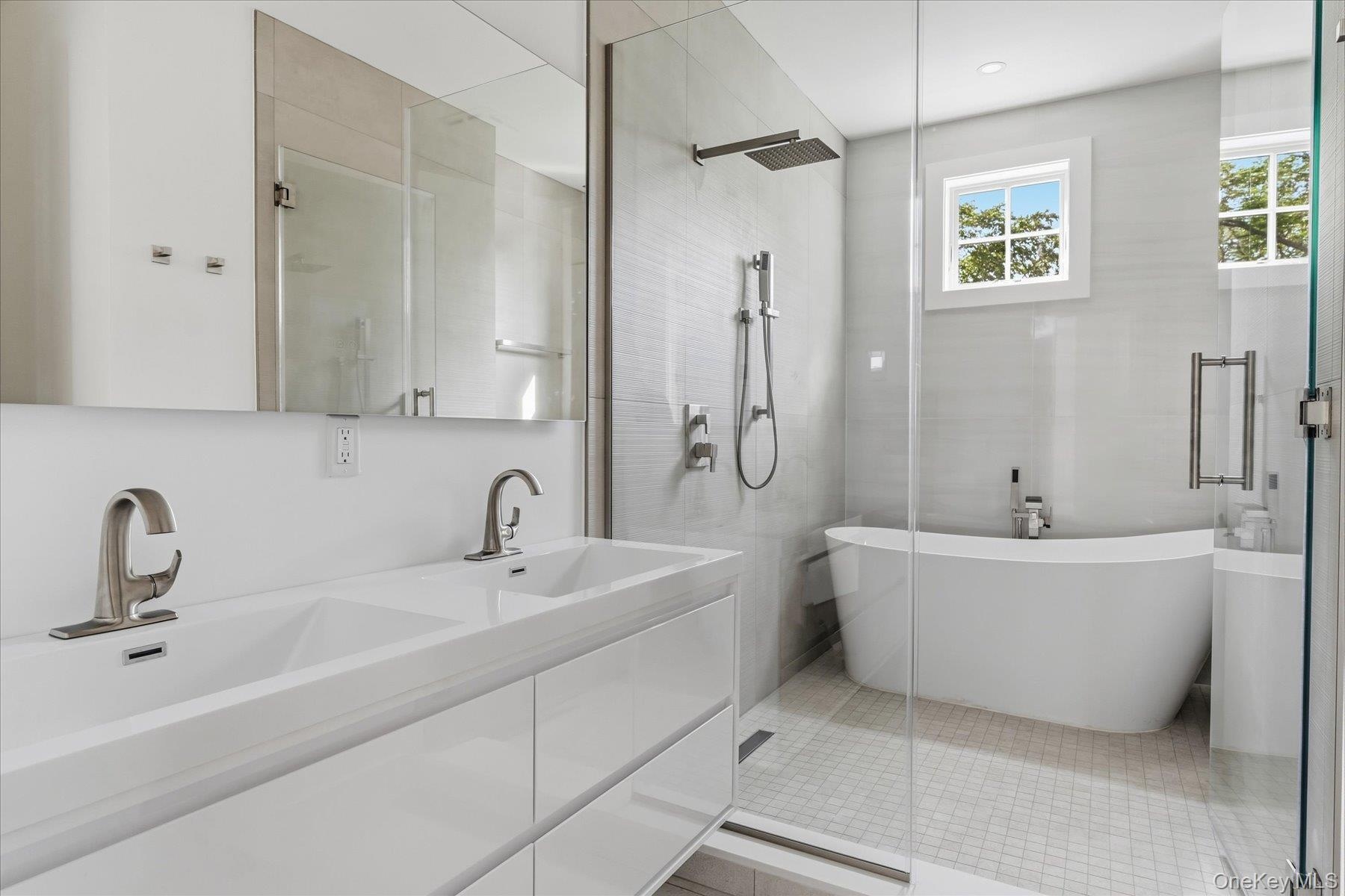 Bathroom with wet room for shower and tub on the second floor.