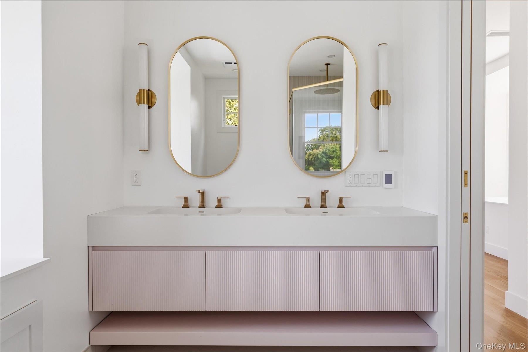 Second floor primary bathroom with custom double vanity.