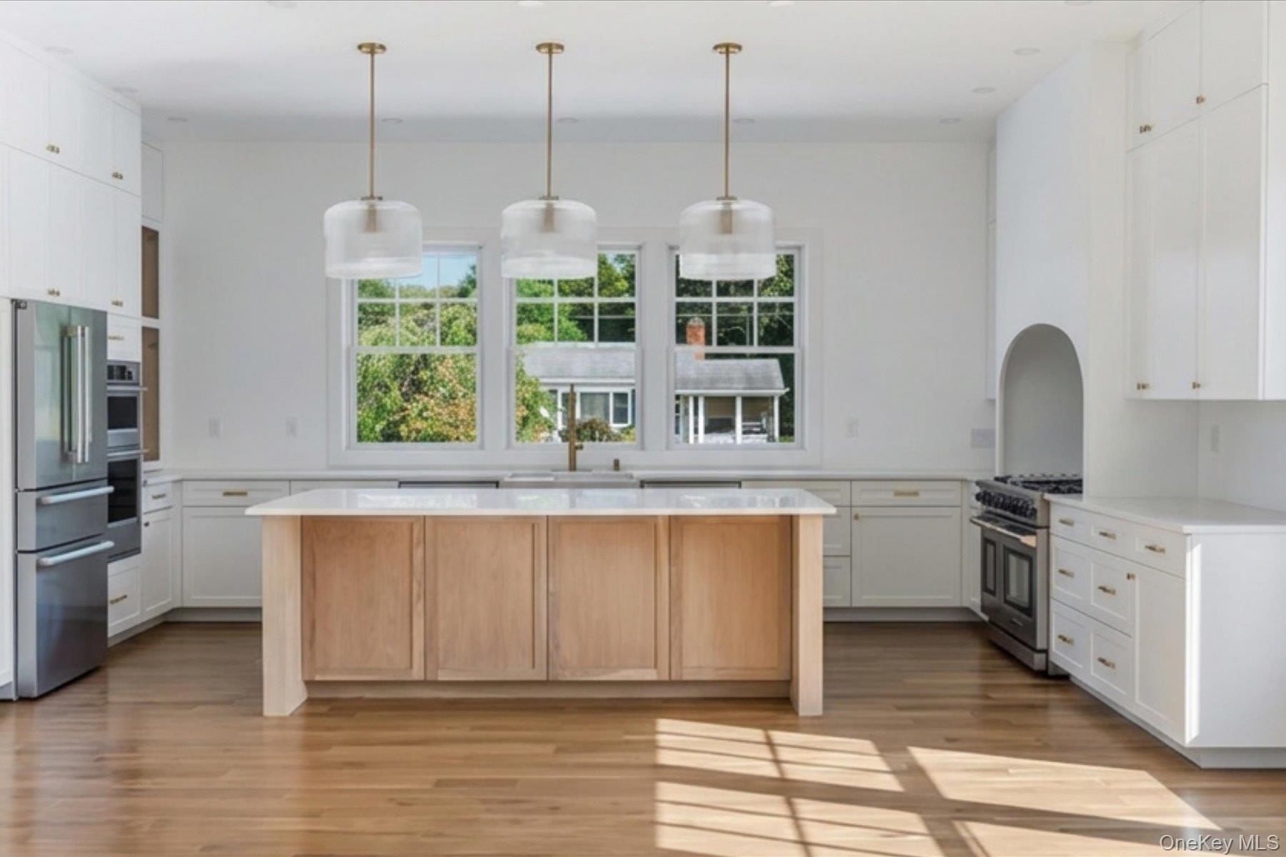 Chefs Kitchen with 48" gas range, double dishwashers and large island.