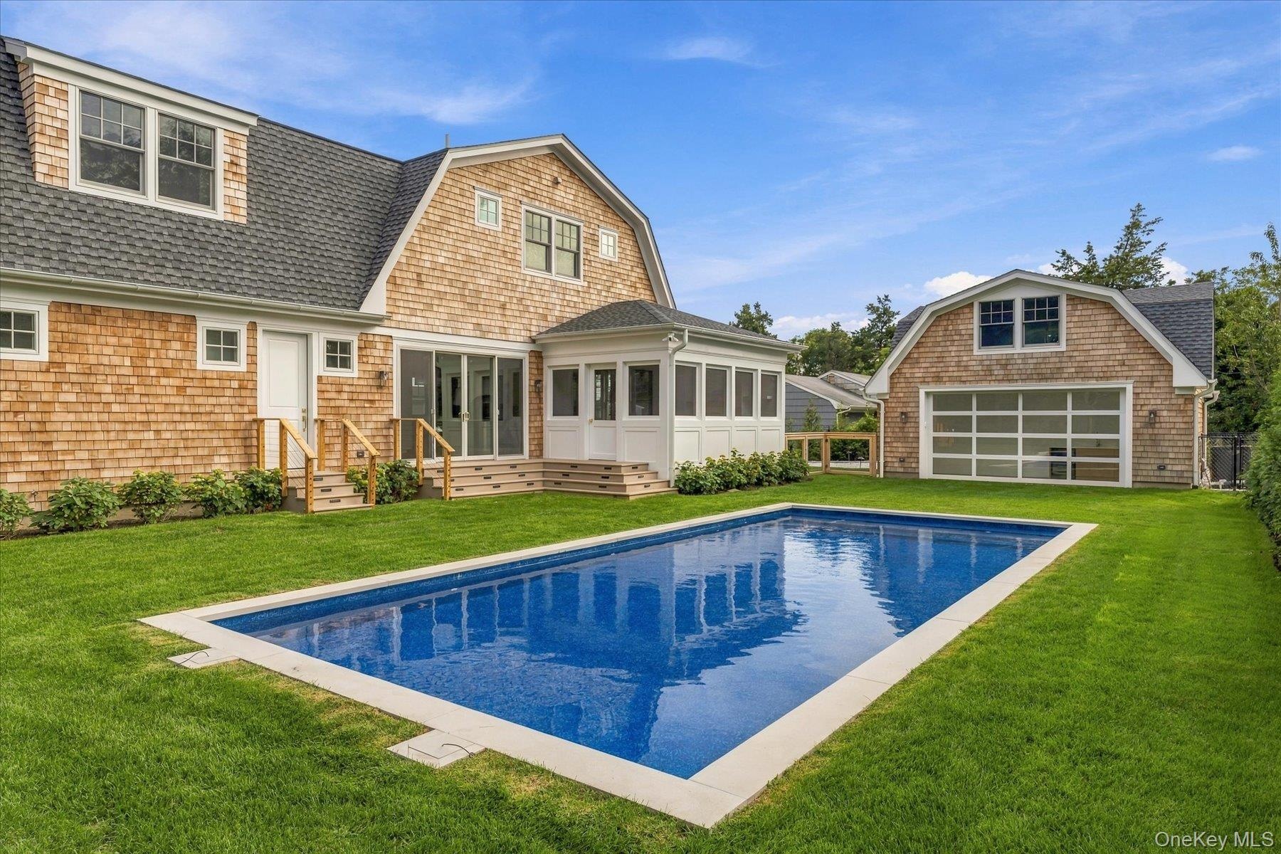 View to the pool house with glass door.