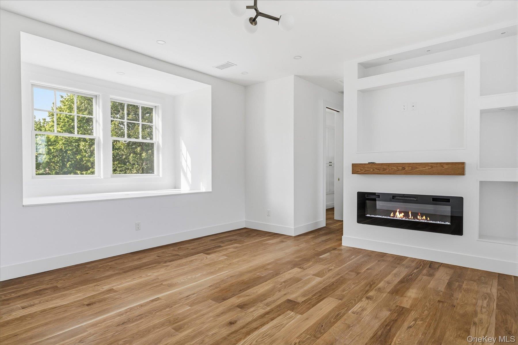 Second floor master suite with ensuite and walk in closet and fireplace.