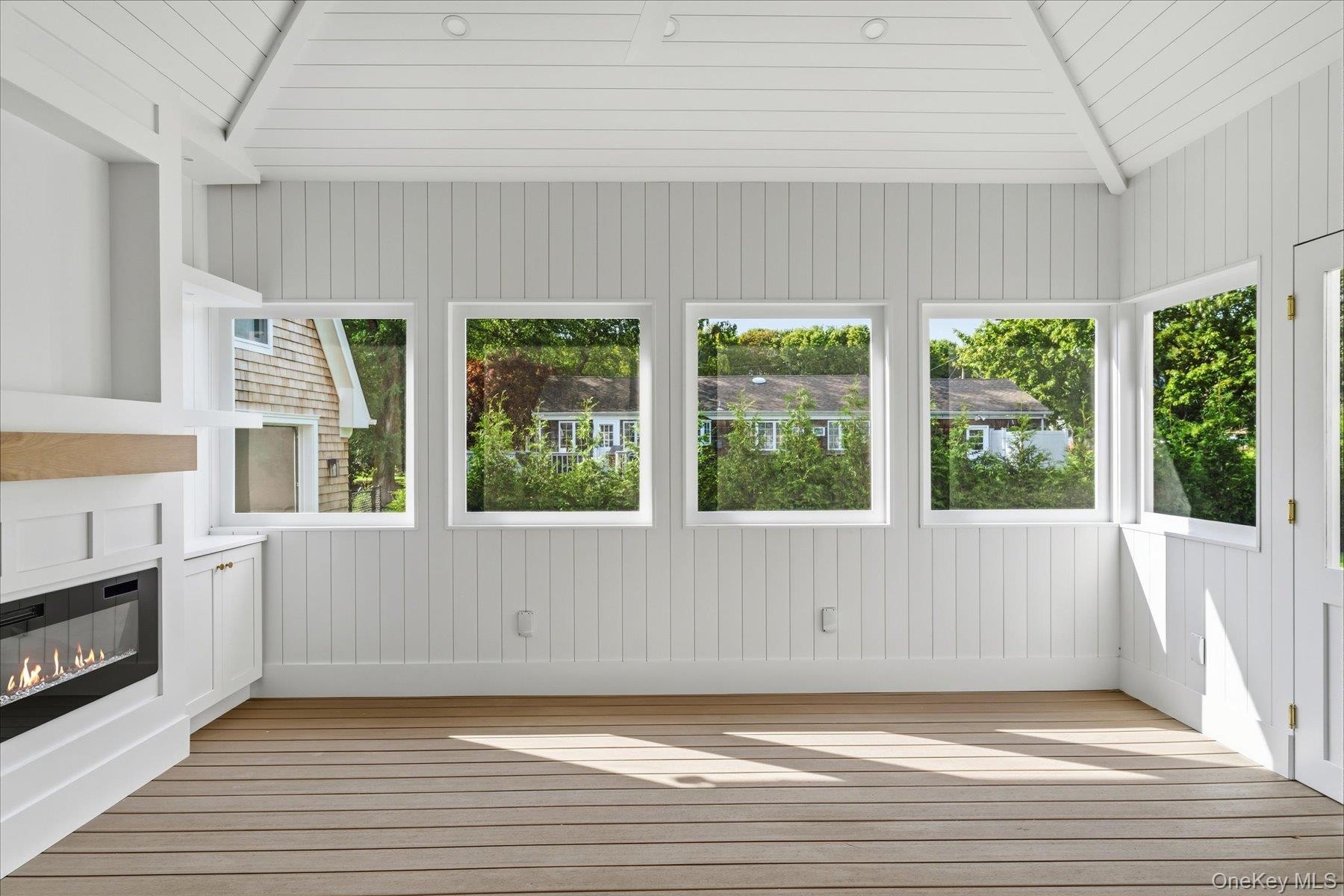 Three Season Room off of the living room and direct access to the pool