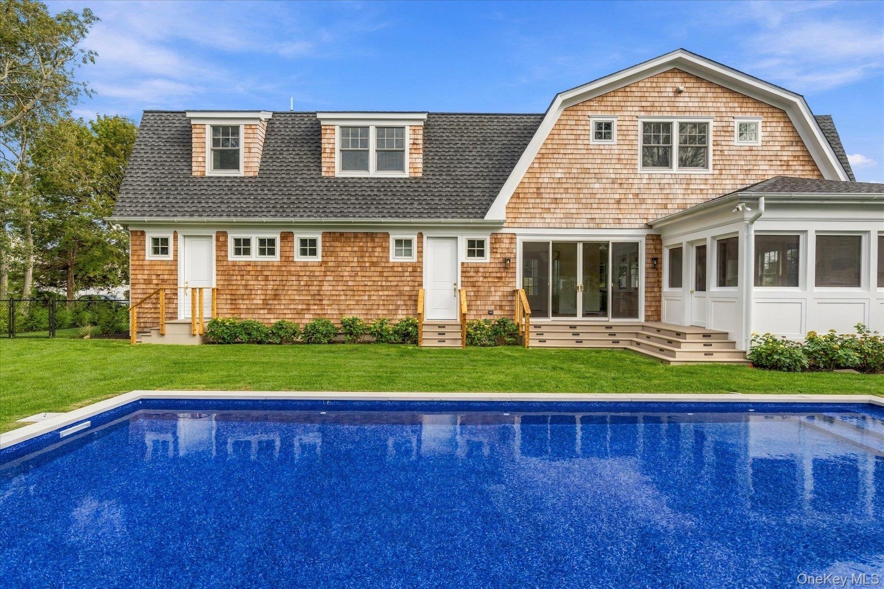 In ground heated salt water pool by efficient heat pump system.