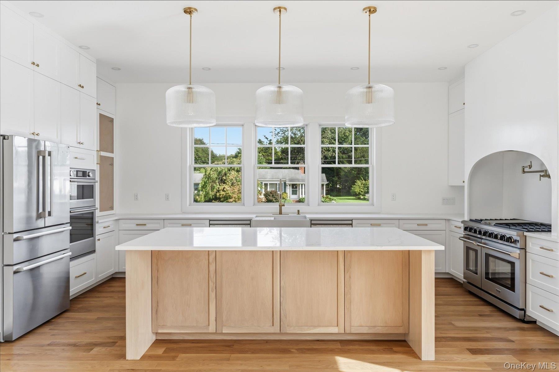 Kitchen ideally situated for entertaining facing the Living room and sun room with direct access to back yard.