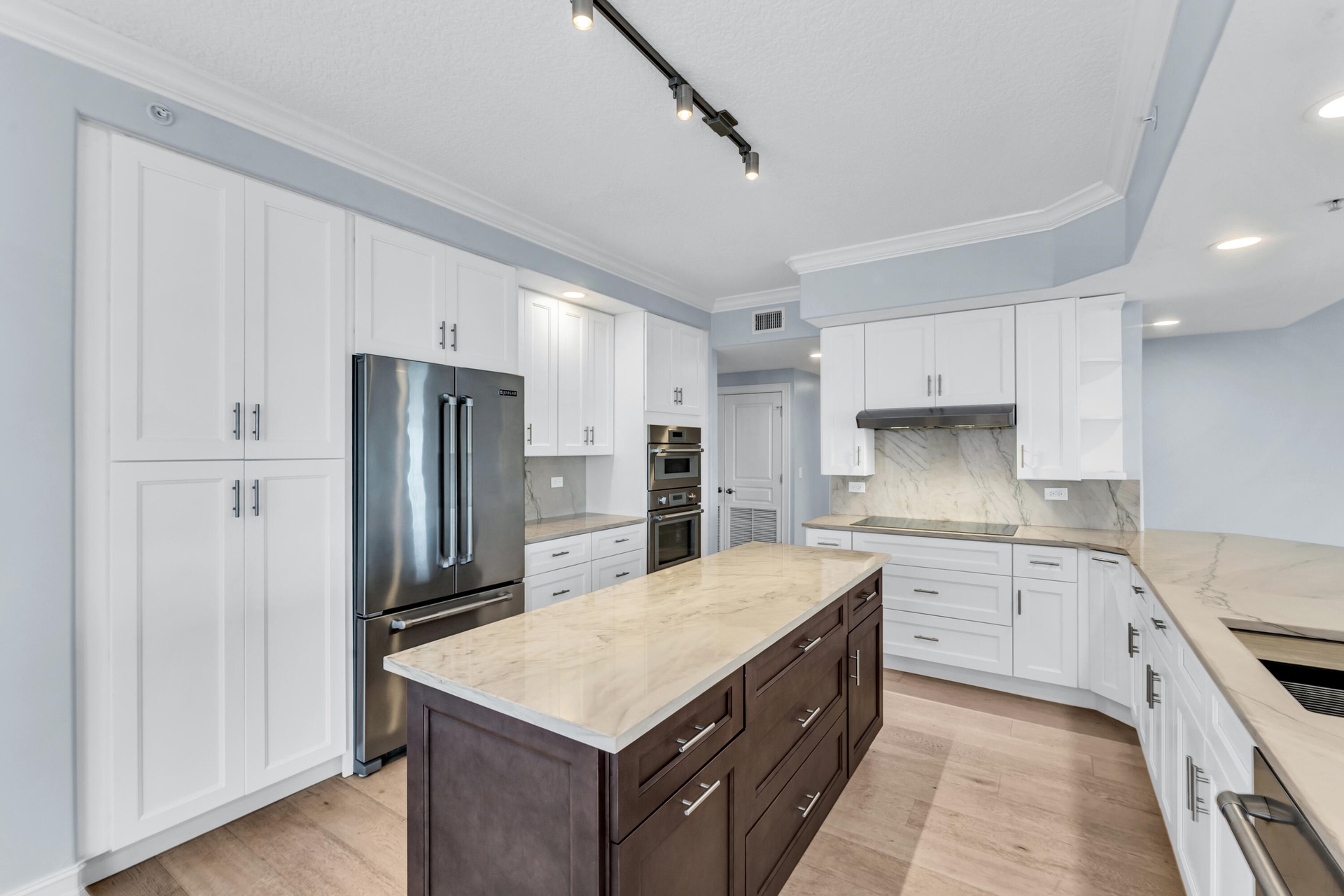 JENN AIR Refrigerator; JENN AIR Dishwasher; Thermador Induction Cooktop; Thermador Wall Oven Microwave Combo; New Cabinetry; Quartzite Countertops wit