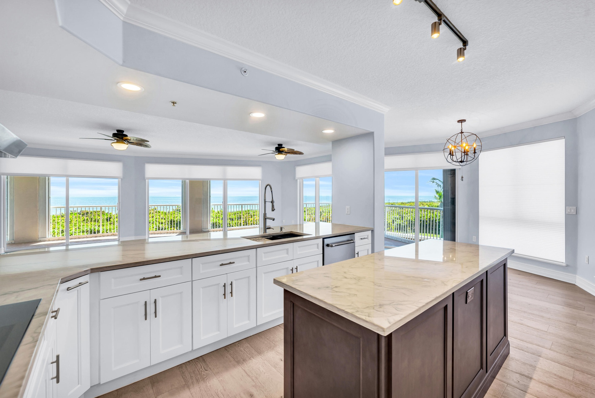JENN AIR Refrigerator; JENN AIR Dishwasher; Thermador Induction Cooktop; Thermador Wall Oven Microwave Combo; New Cabinetry; Quartzite Countertops wit