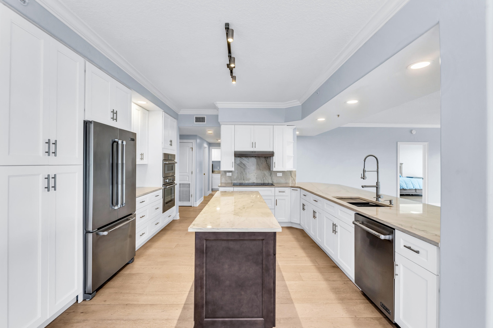 JENN AIR Refrigerator; JENN AIR Dishwasher; Thermador Induction Cooktop; Thermador Wall Oven Microwave Combo; New Cabinetry; Quartzite Countertops wit