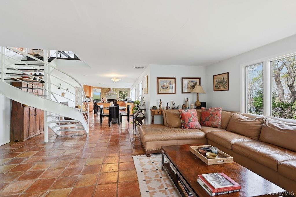 Opens to Dining and kitchen
