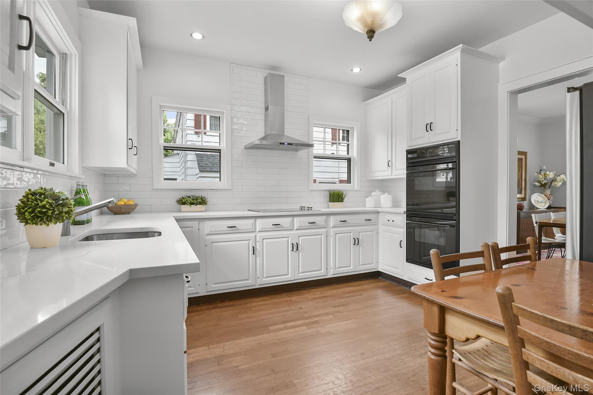 Refreshed kitchen with new quartz counters, double oven, new microwave (2025), new refrigerator (2026) and new cooktop (2025)