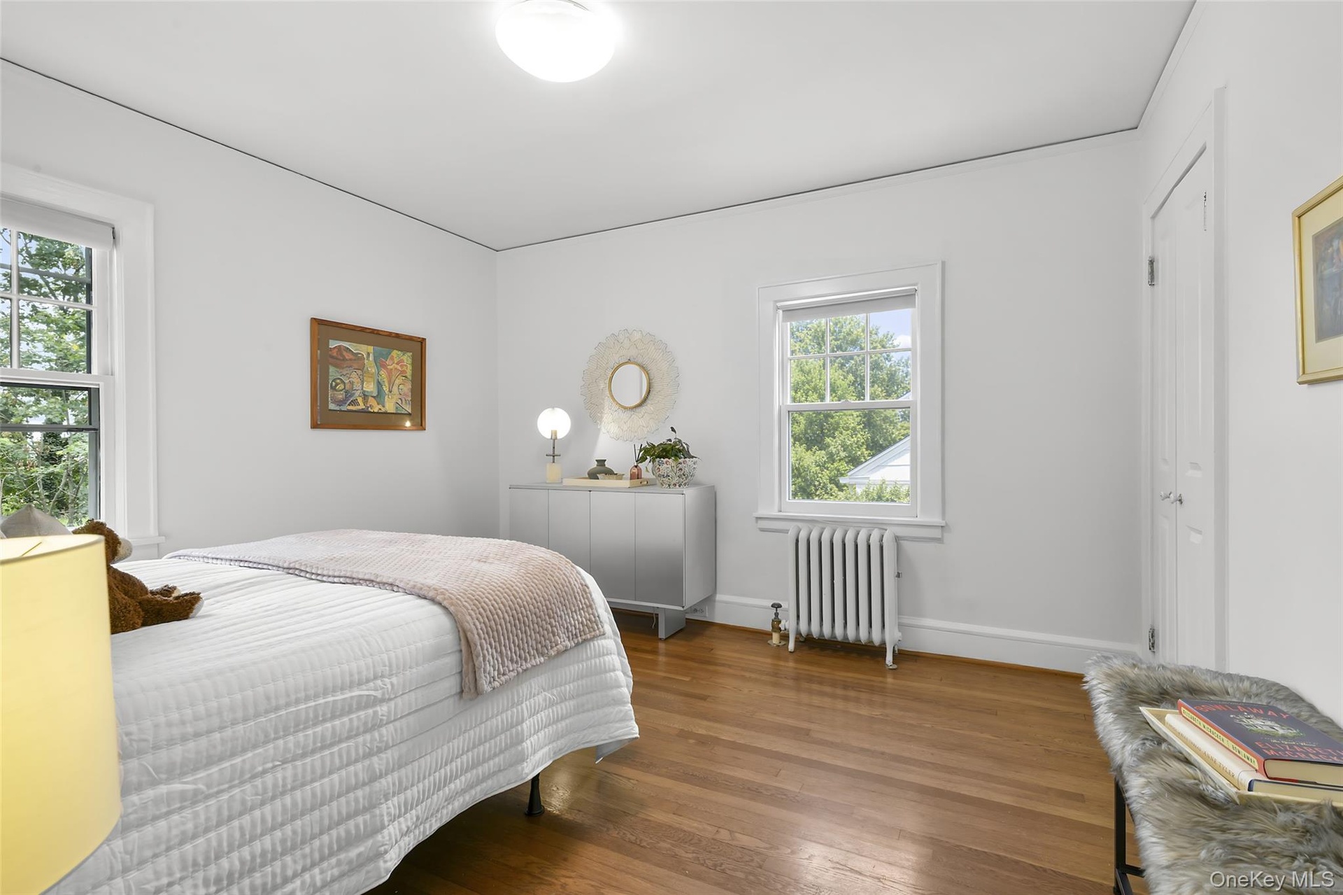 Bedroom #2 of 3, with hardwood floors and closet.
