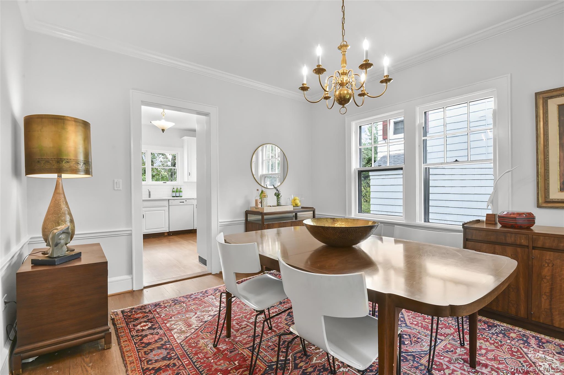 Dining room has hardwood flooring.