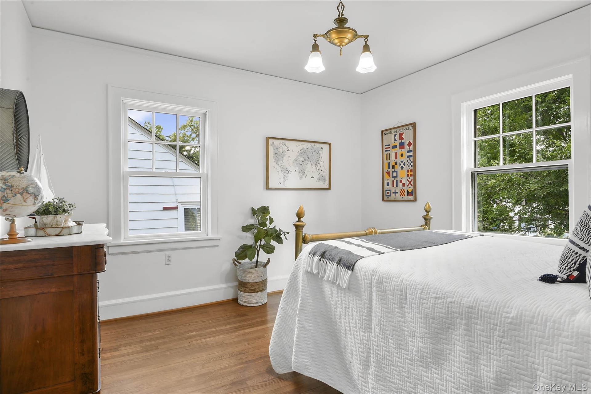 Bedroom #3 of 3, with hardwood floors and closet.