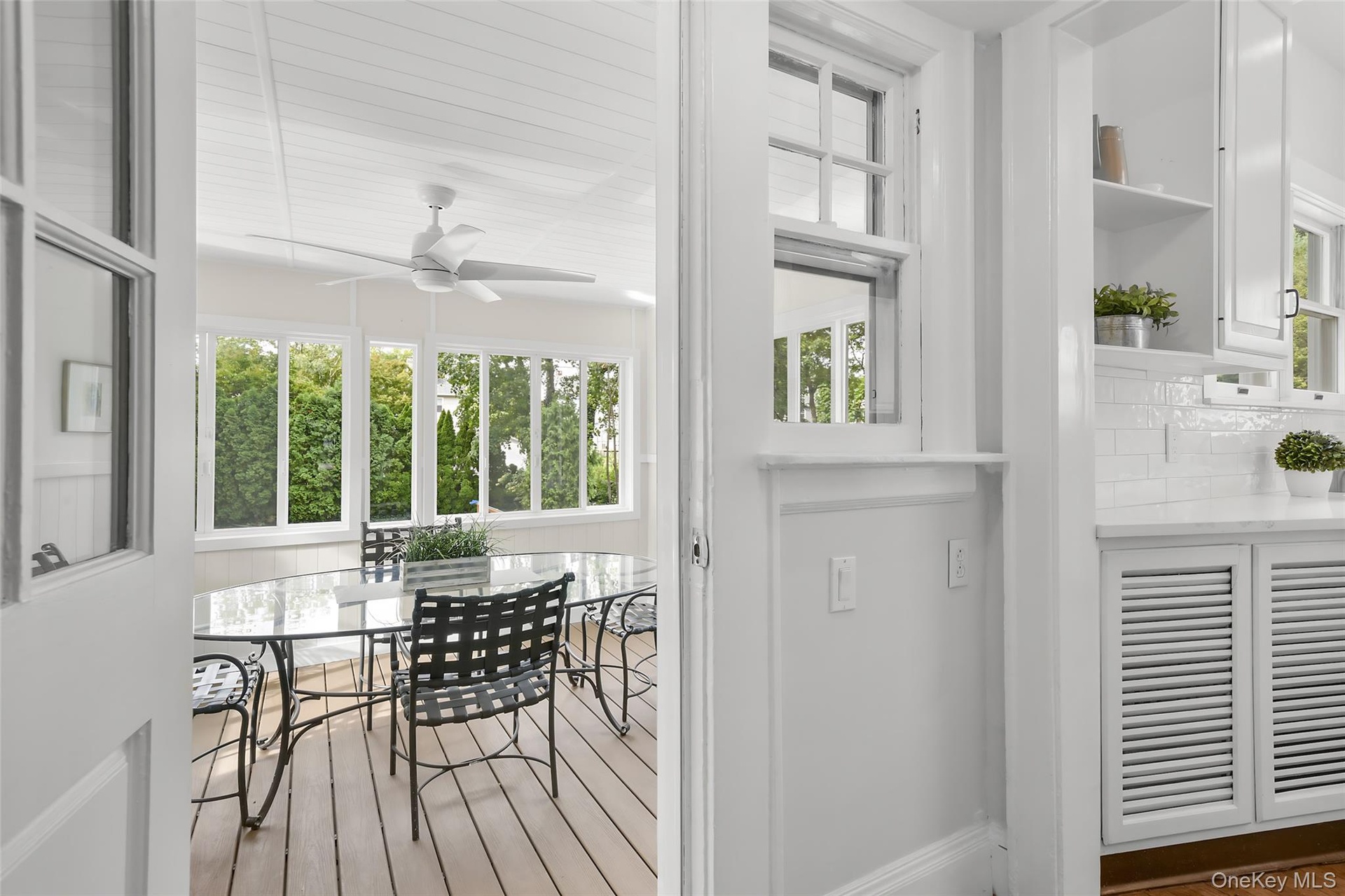 Porch off back of house, overlooks backyard and pool.