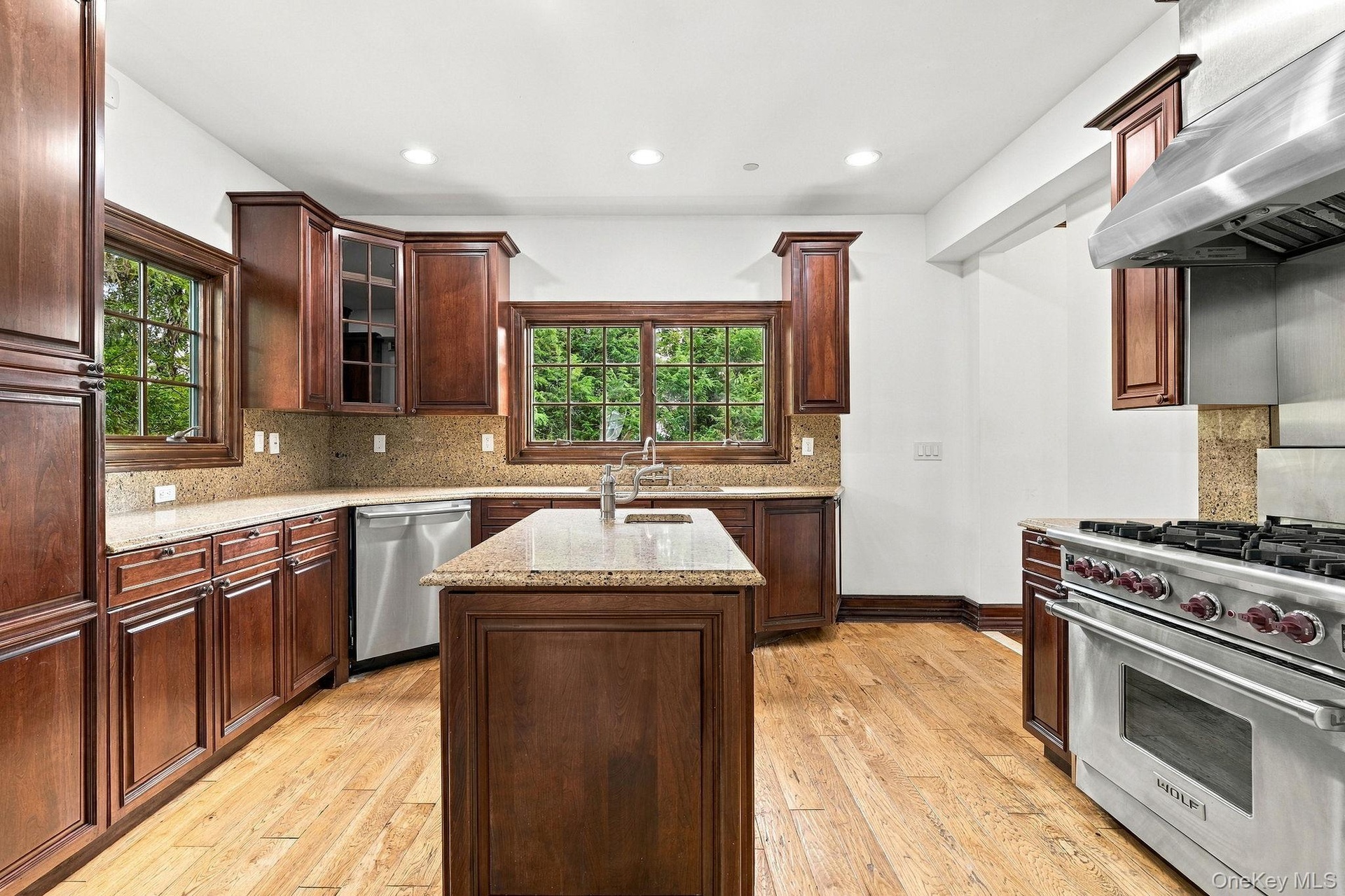 Granite, cherry cabinetry and high-end appliances come together beautifully.