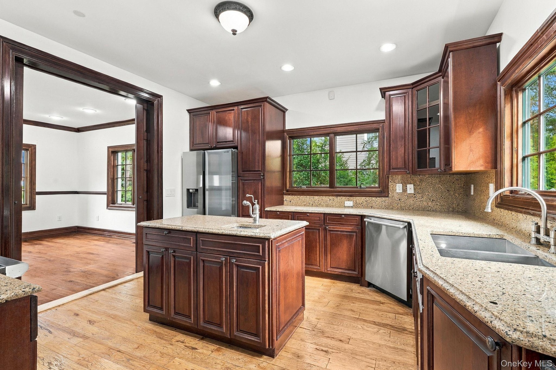 Rich cherry cabinetry brings warmth to the kitchen.