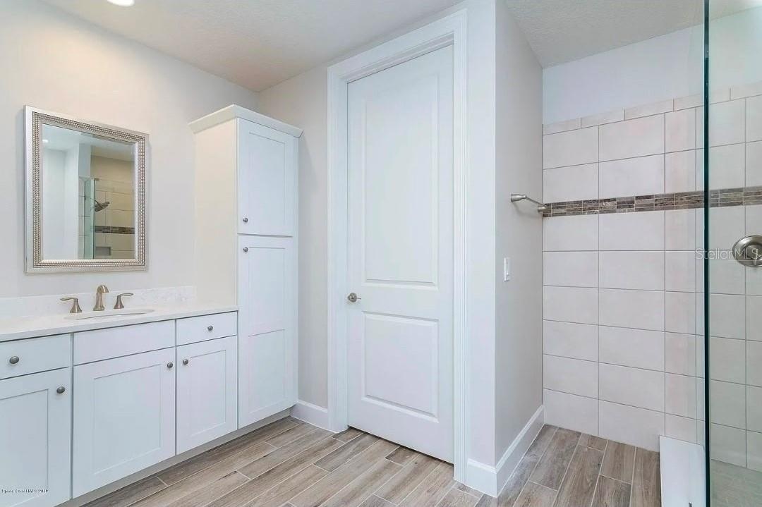 Master bath has 2 vanities,  water closet.