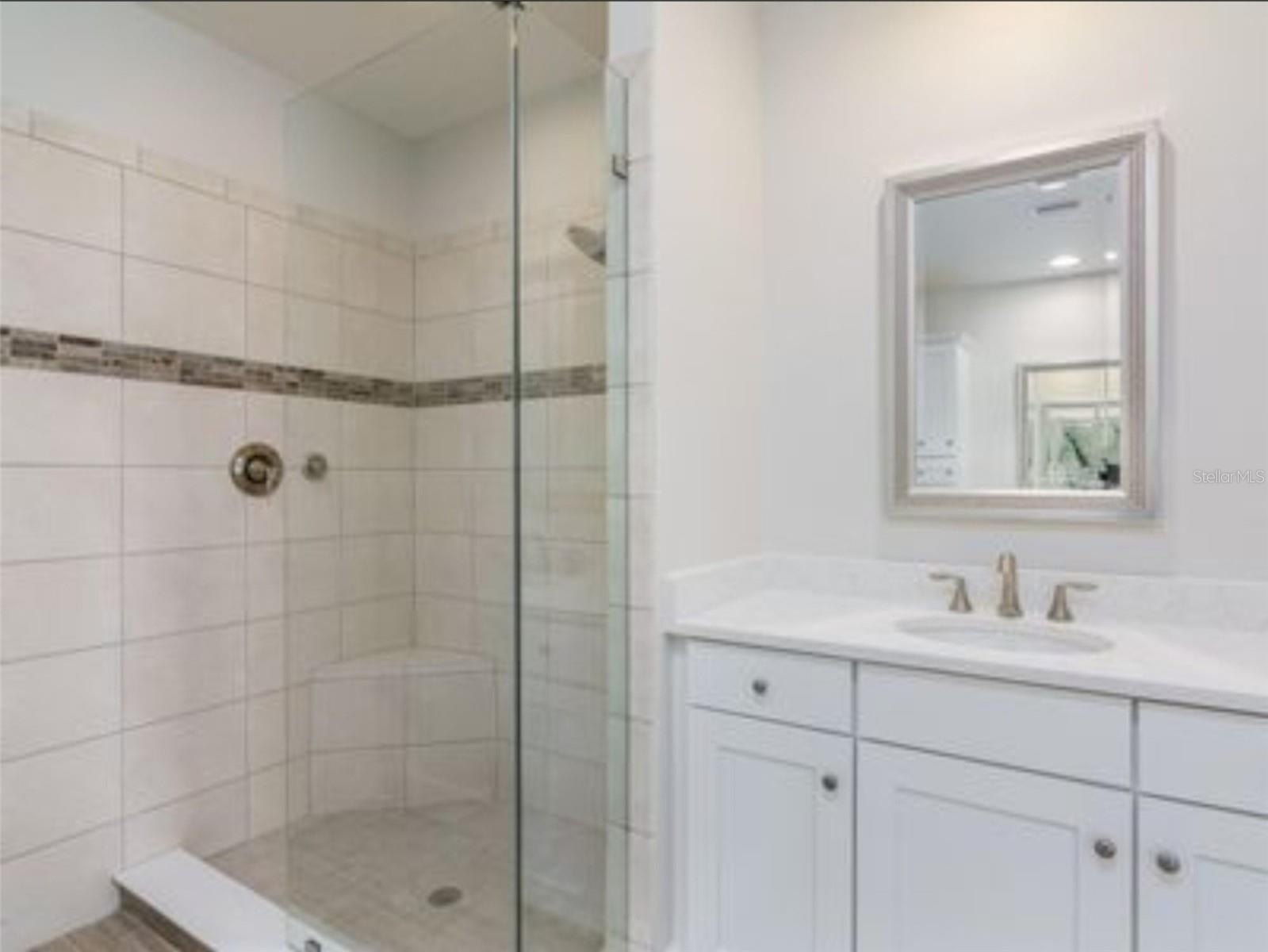 Primary Suite East , 2 vanities, shower, water closet.