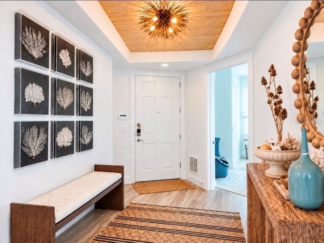 FOYER TO THE RIGHT IS THE PRIMARY WEST BATHTO THE LEFT THE 3RD BATH AND LAUNDRY ROOM.