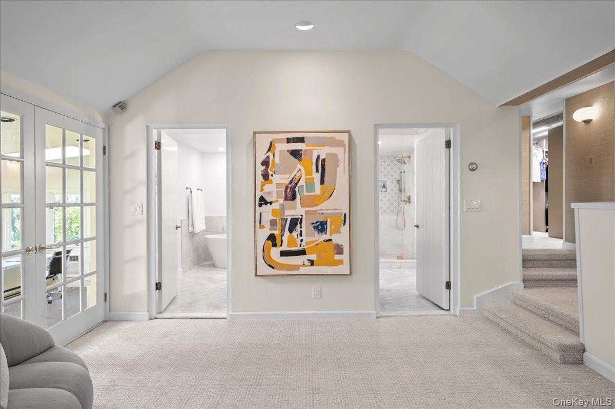 The primary suite features an updated primary bathroom with soaker tub and spa-like shower.