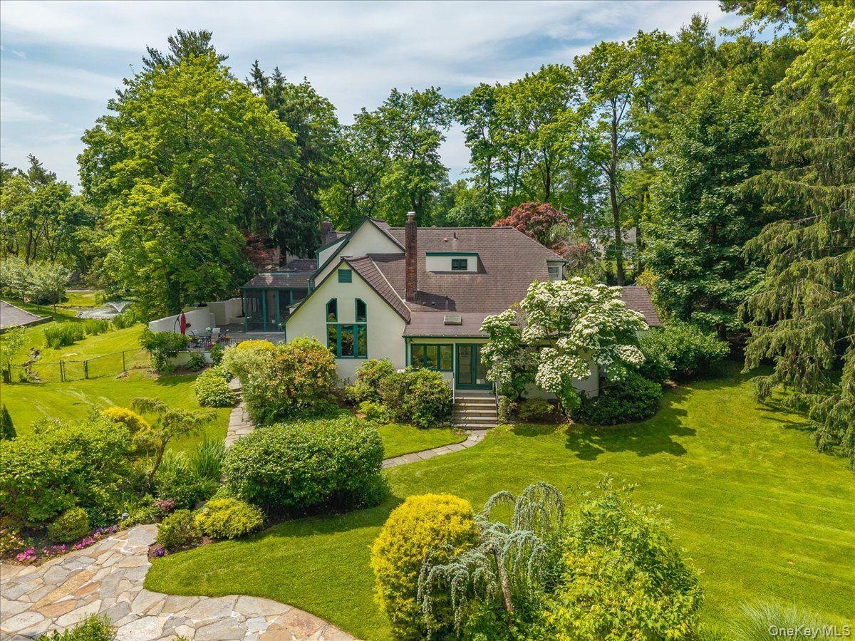 This home is situated on an acre of lush property. It is surrounding by mature trees and feels private and serene.