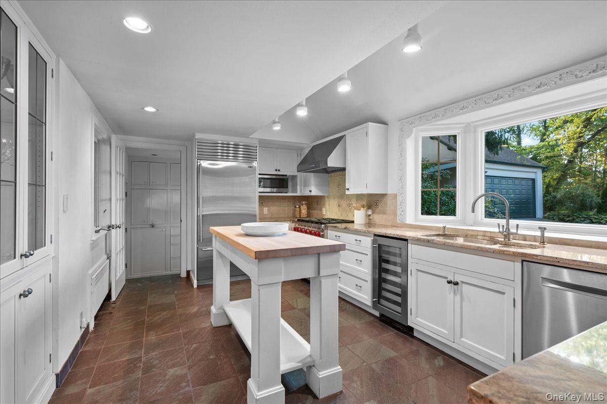 The kitchen opens onto the breakfast room and connects to the formal dining room; an ideal layout for entertaining.