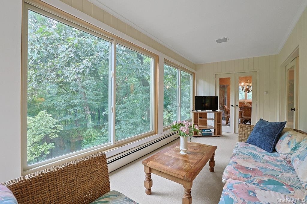 Sunroom overlooking private backyard