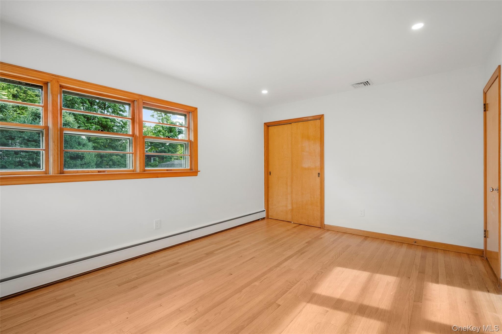 Bedroom with natural light and mid-century window detail