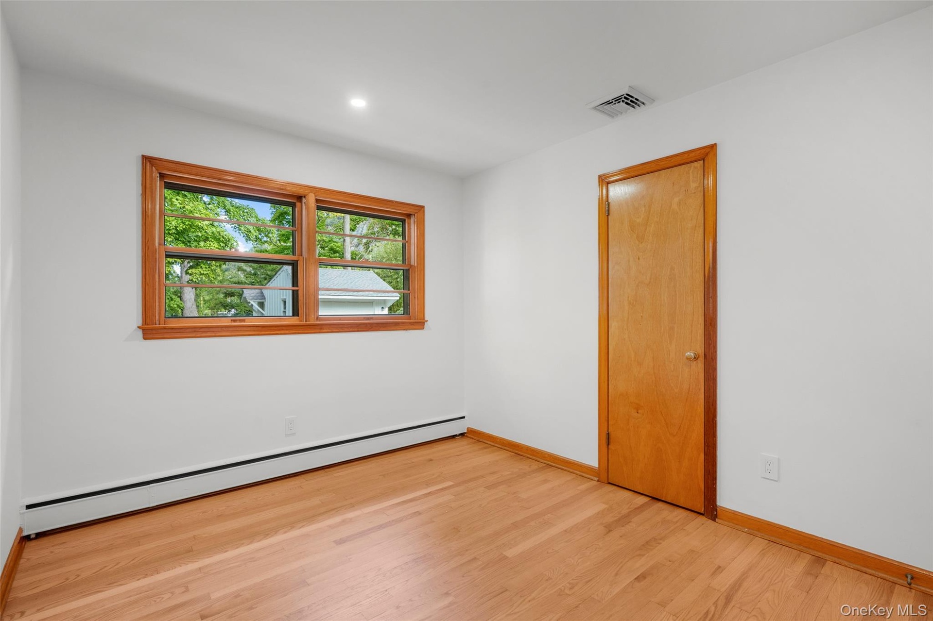 Sunny bedroom with closet