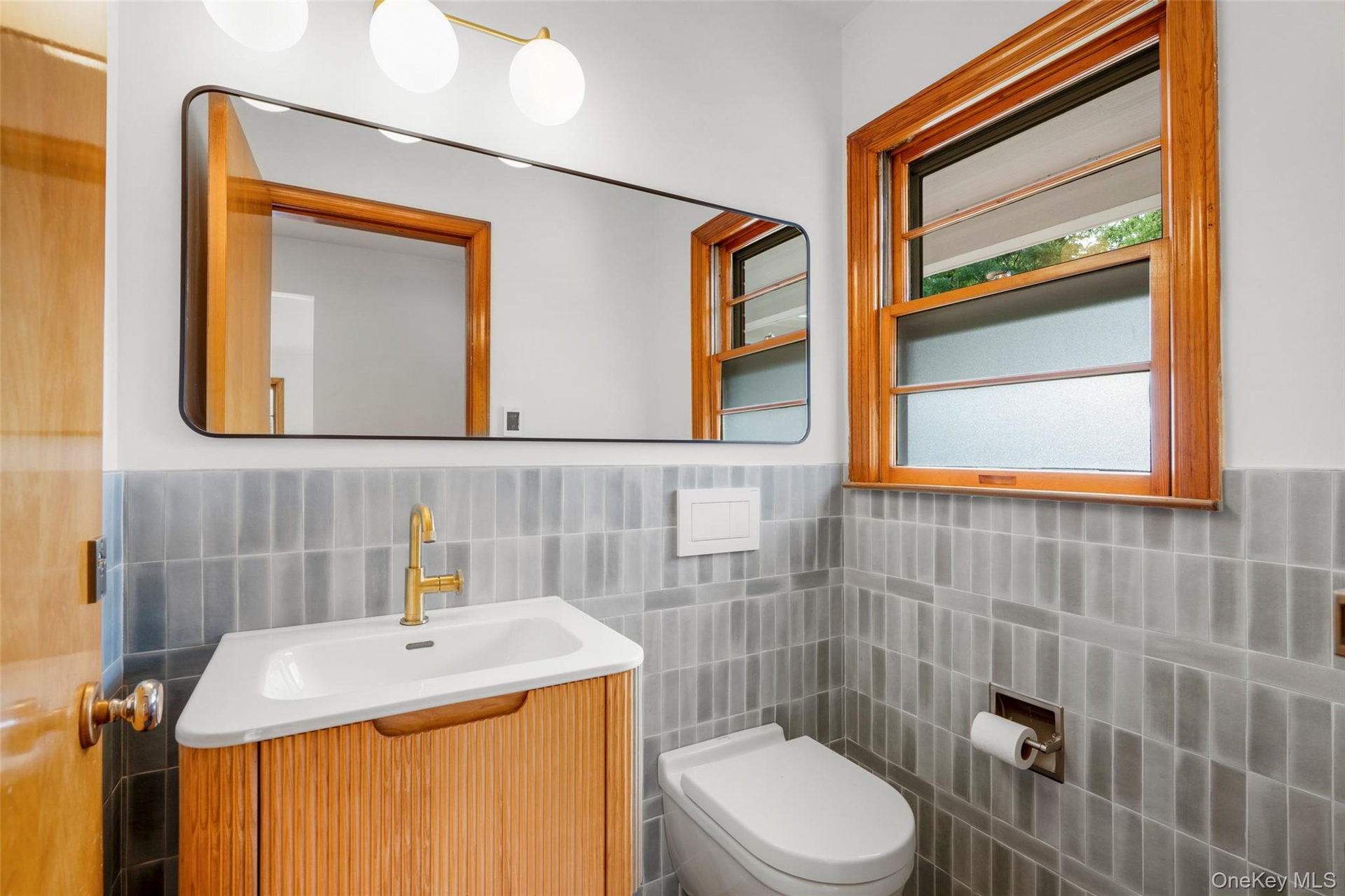 Half bath with elegant glazed tile