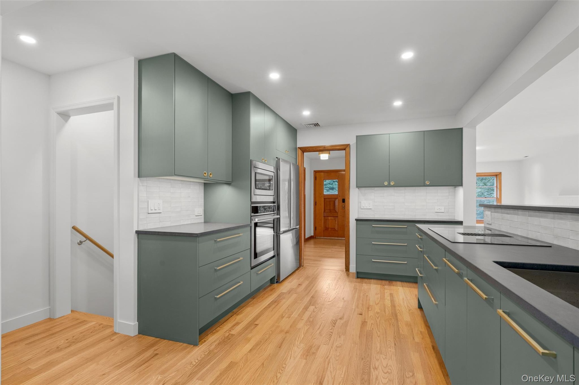 New kitchen with generous counter and cabinetry