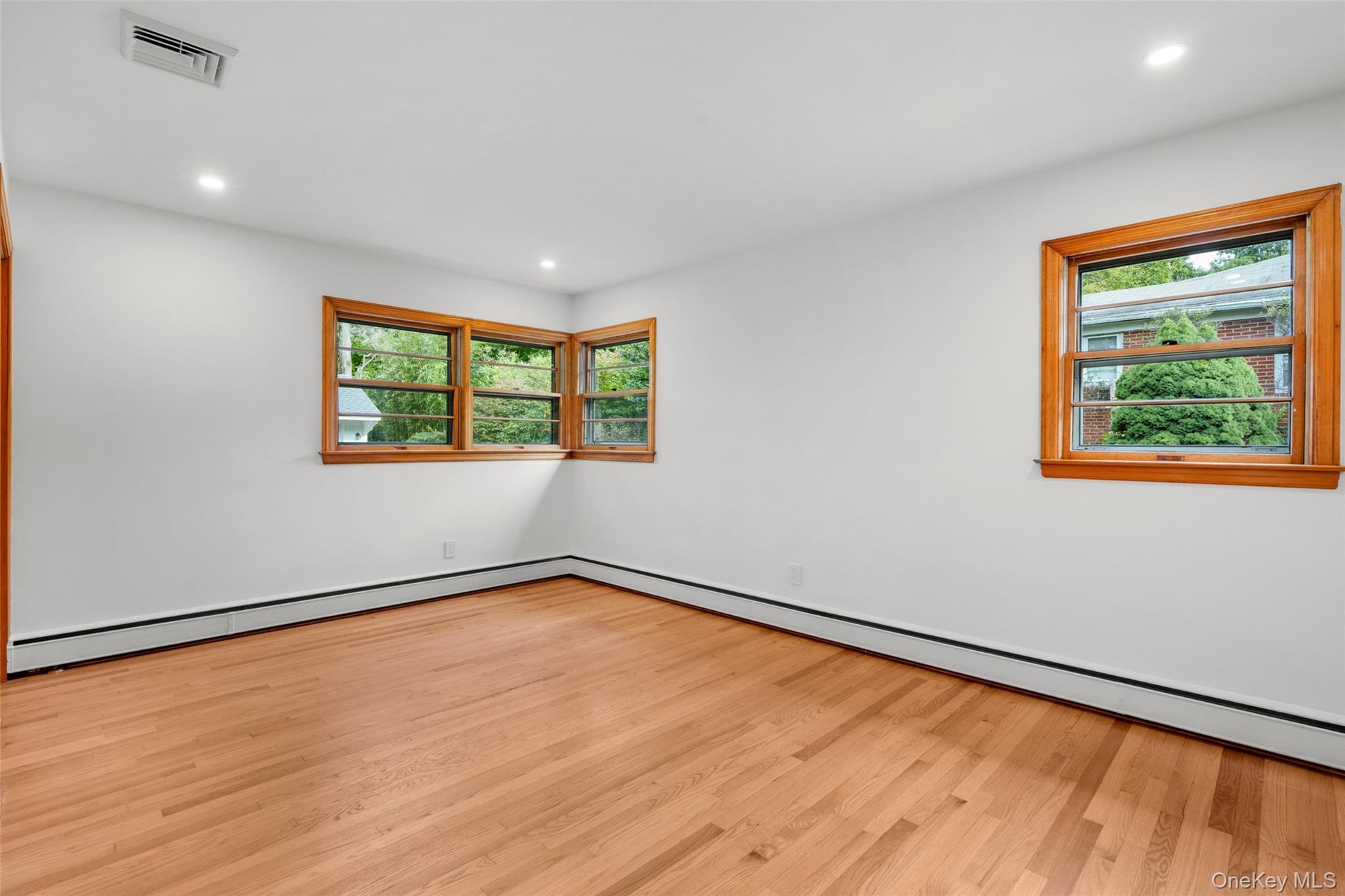 Bedroom with natural light and mid-century window detail