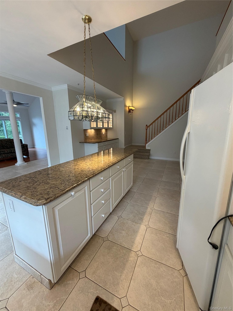 Extended granite counter with cabinetry