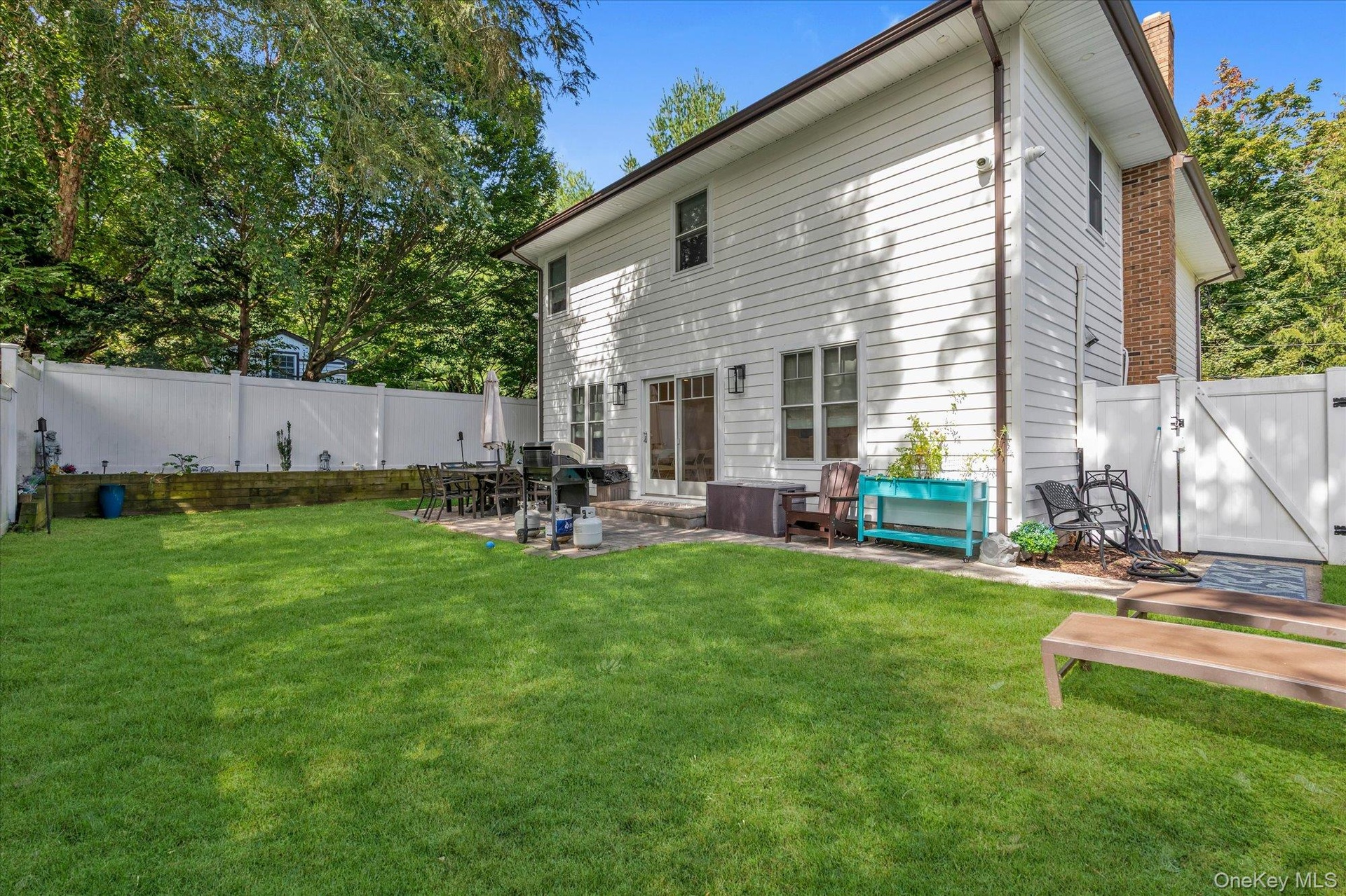 Spacious patio directly off the kitchen.  Totally fenced rear yard.