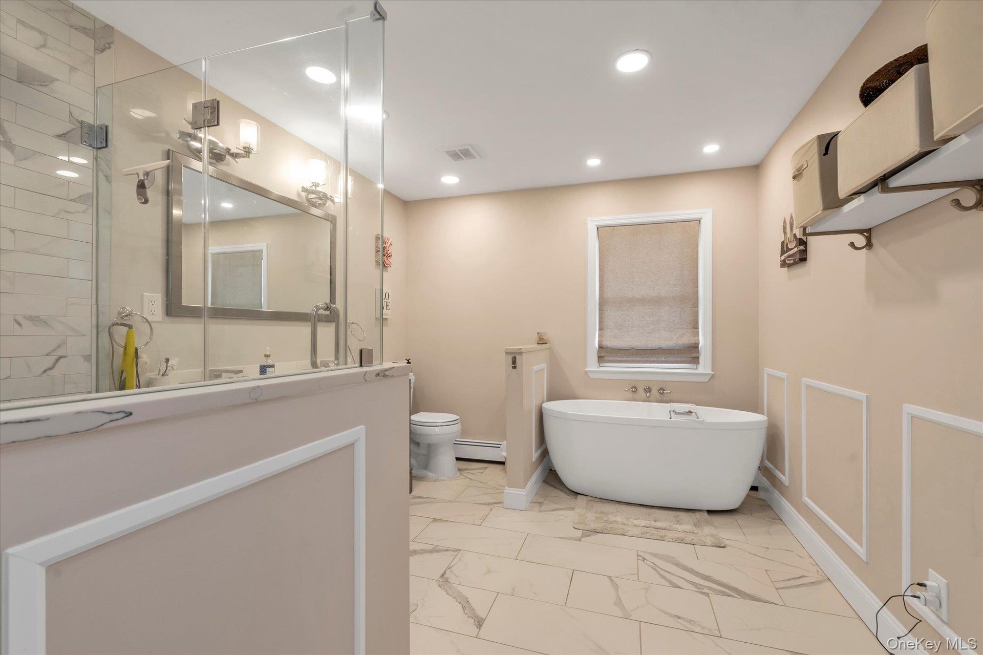 Bathroom #1En-suite spacious walk-in shower and soaking bathtub.