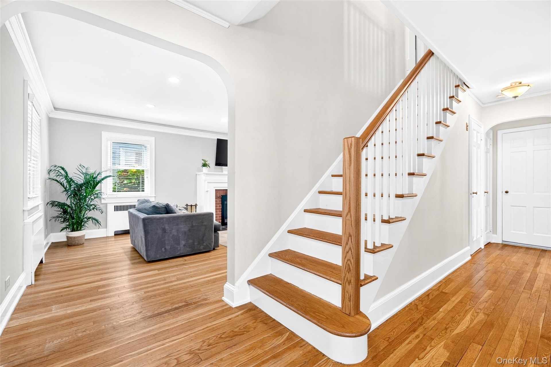 Stairs to second floor and front door entry
