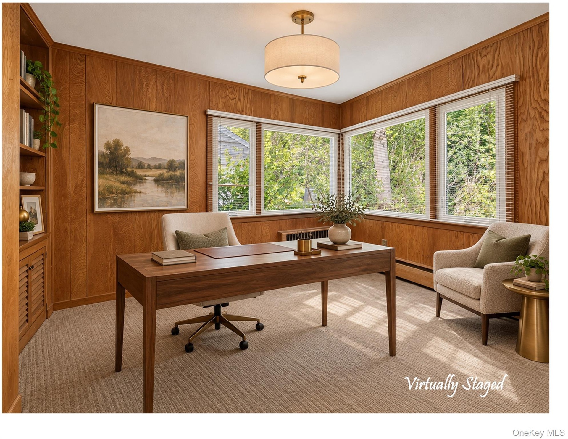 Just off the dining room is the dedicated office.  With bright corner windows and built-in storage, it's the perfect spot to get down to business in c
