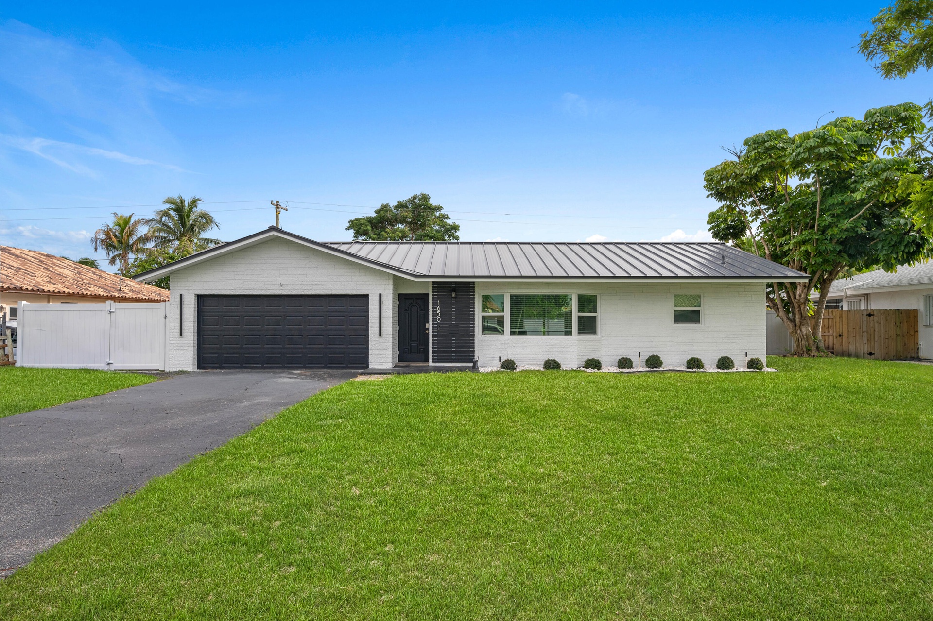Two Car Garage with Mini Split AC and a Large Driveway!