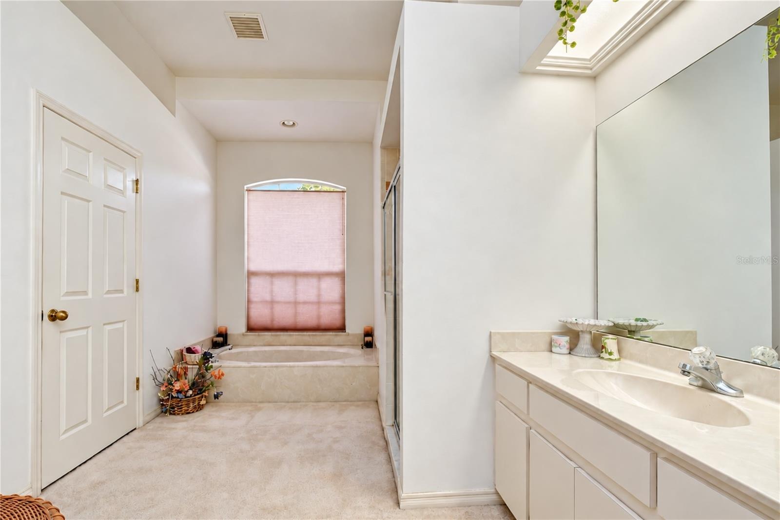 En-suite bathroom offers a relaxing and functional private retreat.