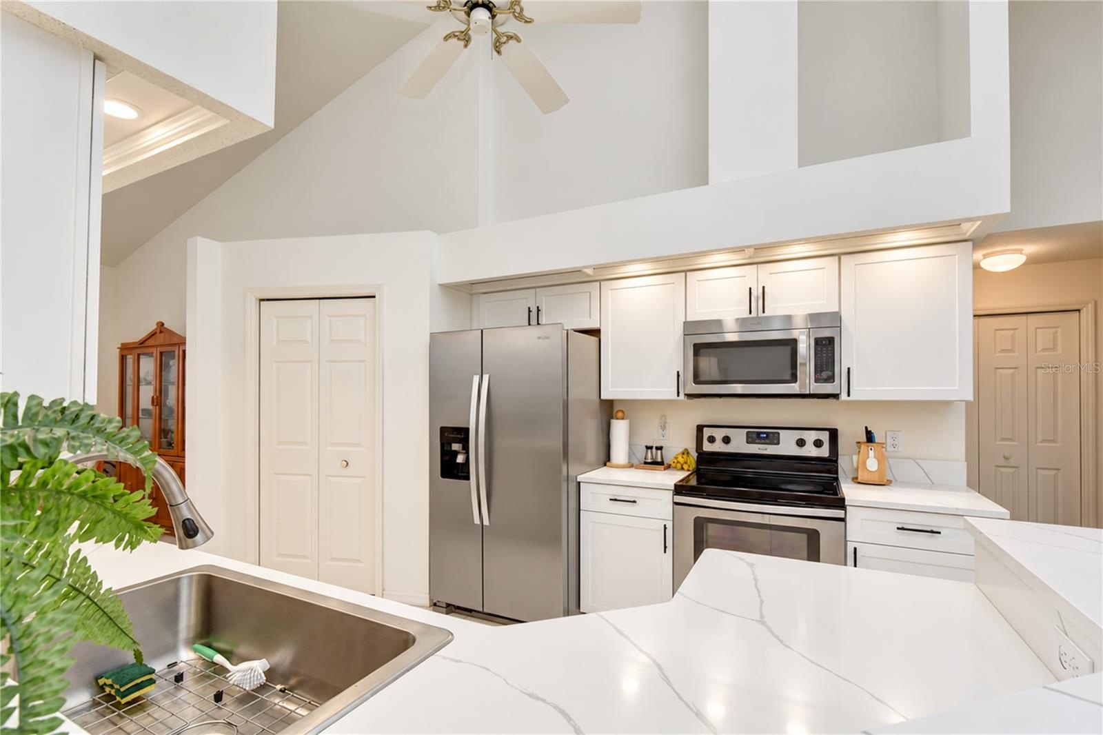 Stainless appliances complement the kitchen's clean and updated design.