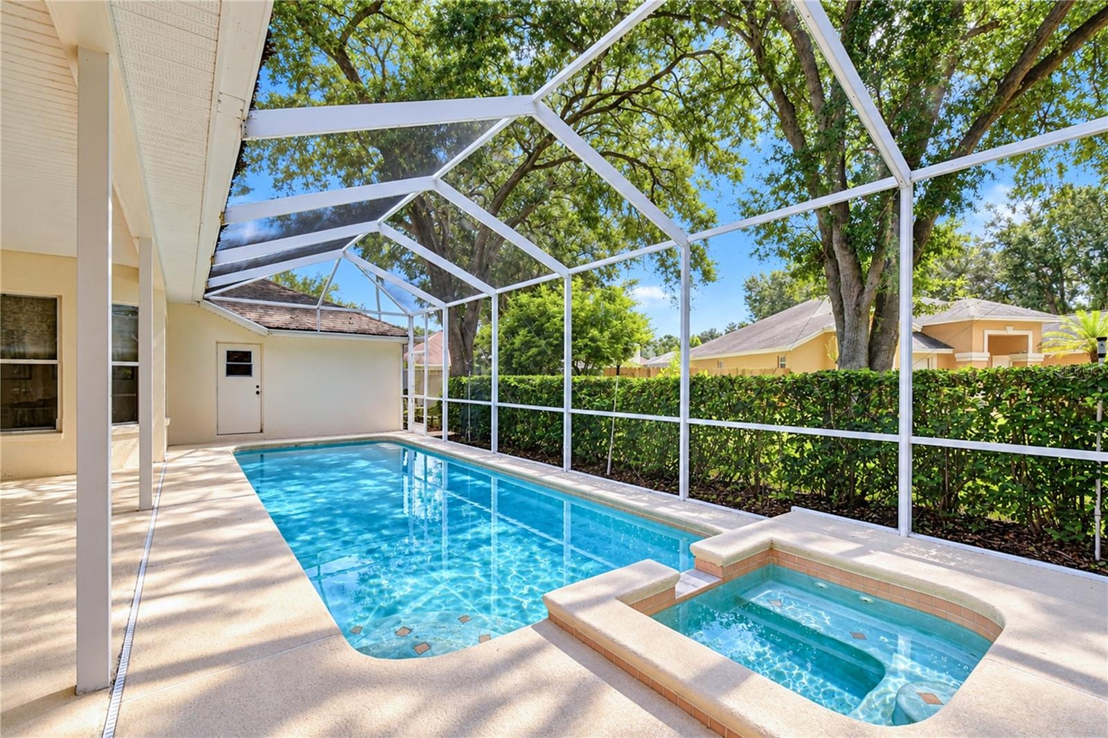 Attached spa adds a relaxing resort-style feature to the outdoor living space.