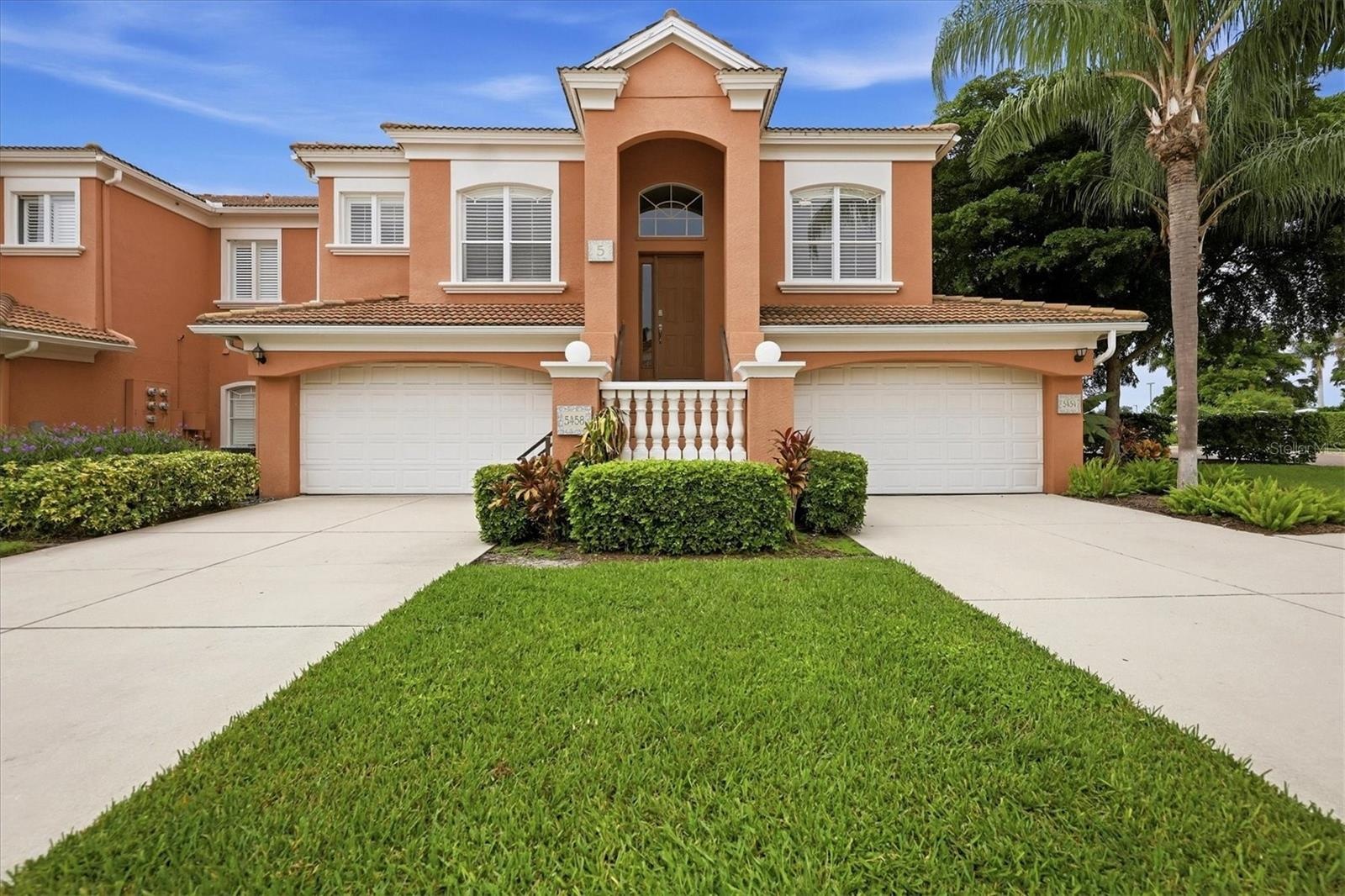 unit 5458 is upstairs with a private garage (left side) which has two storage closets