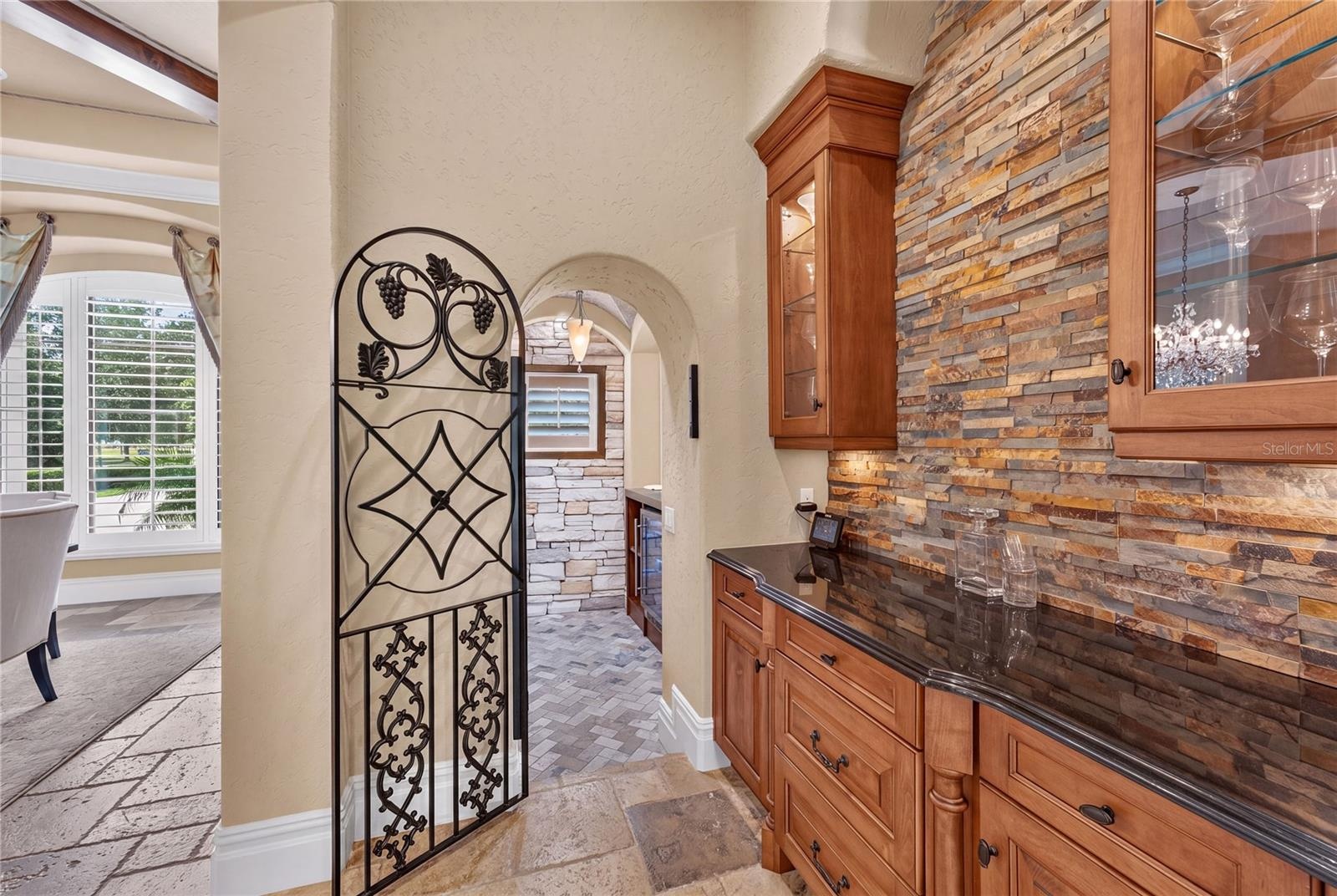 Just off the dining room is the dry bar and Wine Room.