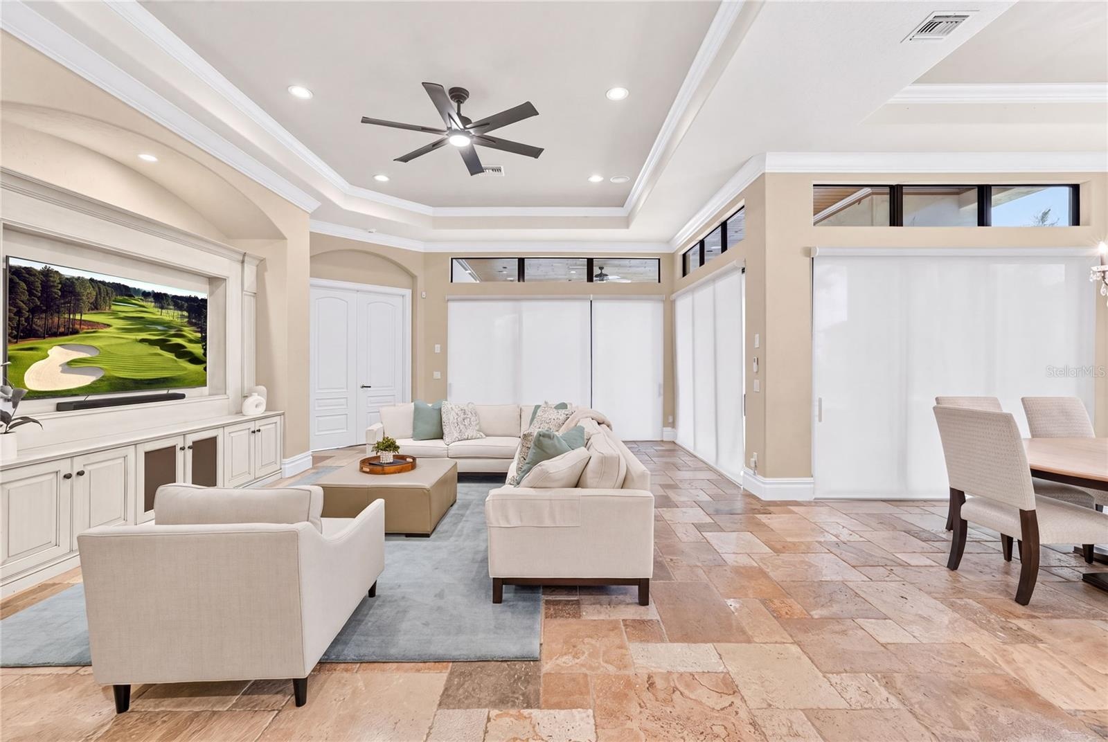 Each set of sliders to the back of the home offer remote controlled automatic shades for privacy and light control.