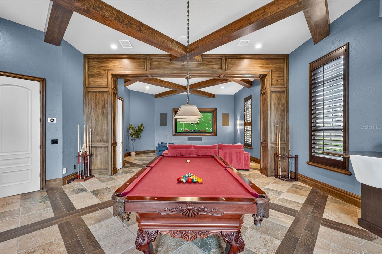 The NEW 100' Television conveys with the home ($10K value)!. The closet entry midway down left wall opens to AV equipment.