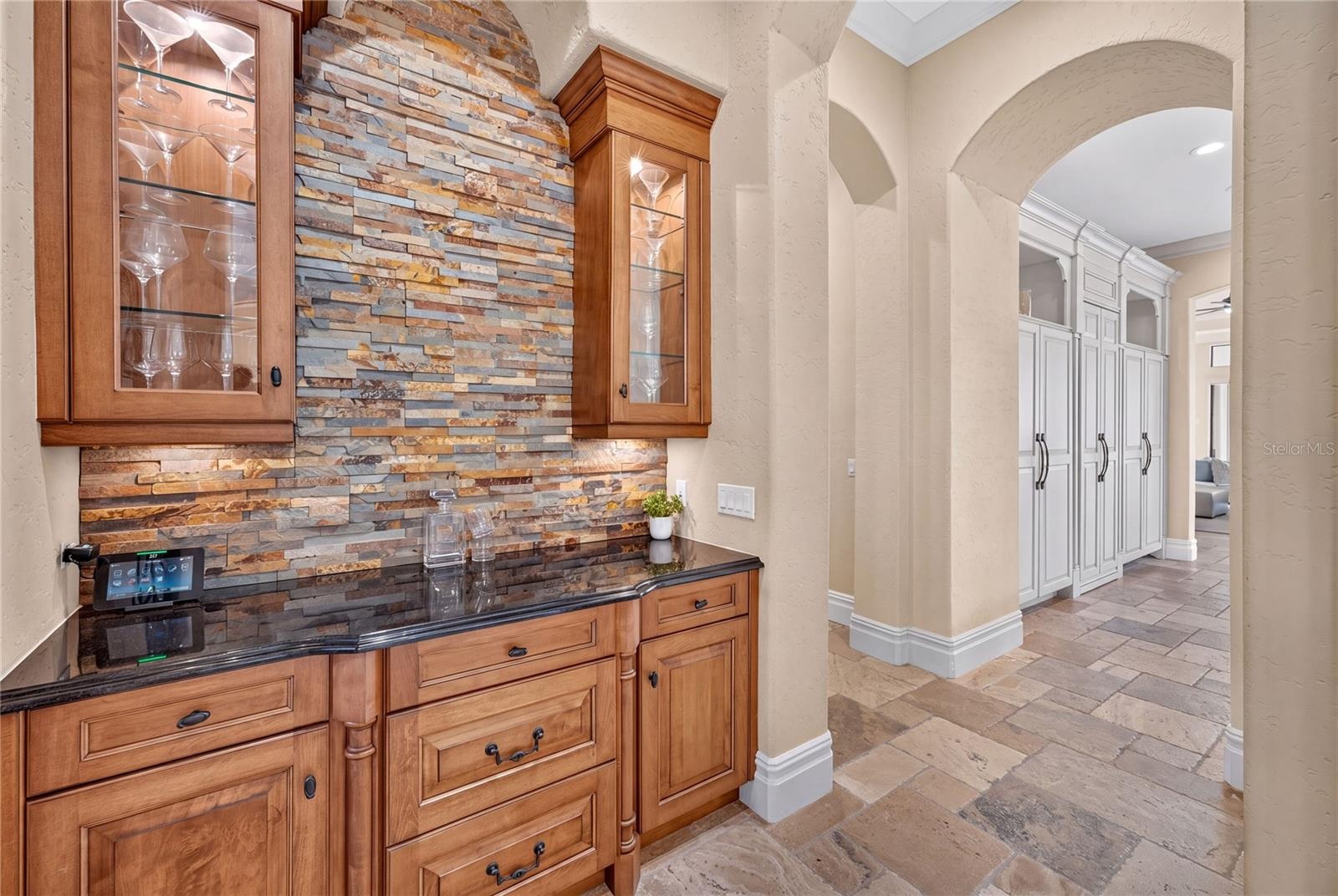 The beverage bar is easily accessible from the kitchen seen to the right.